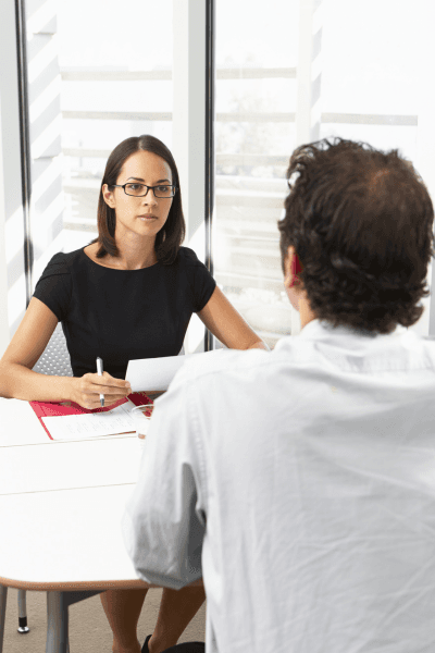 Hiring professional reviewing employment information with a candidate