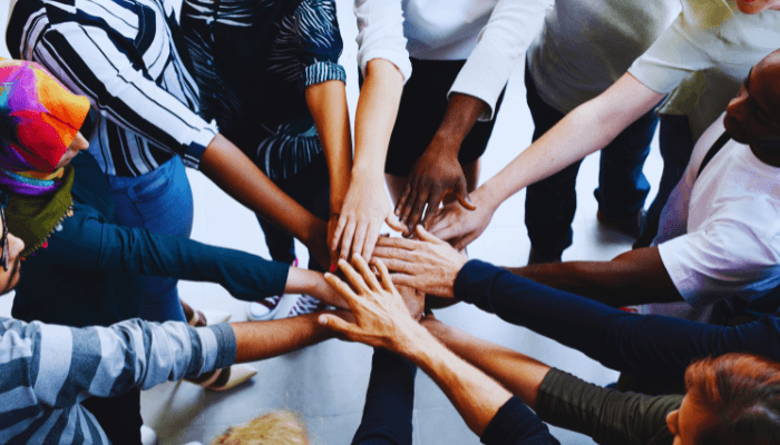 Team hands together representing the Varifox mission